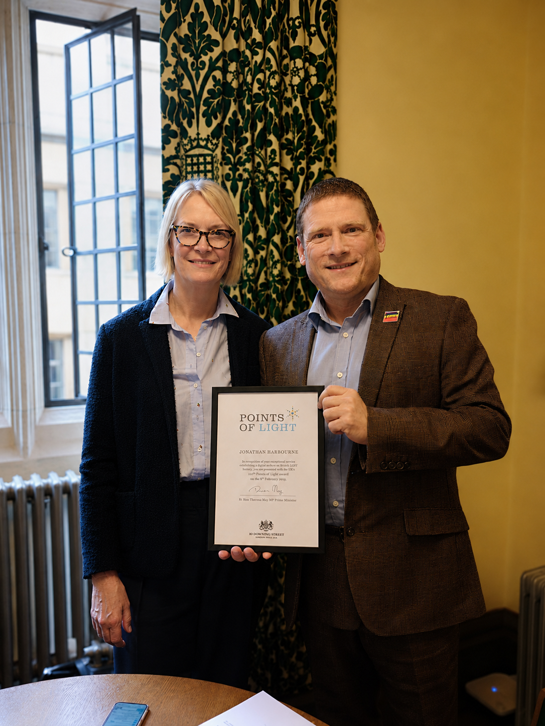 Jonathan Harbourne receiving the Prime Minister's Points of Light award from Rt Hon Theresa May MP, February 2019